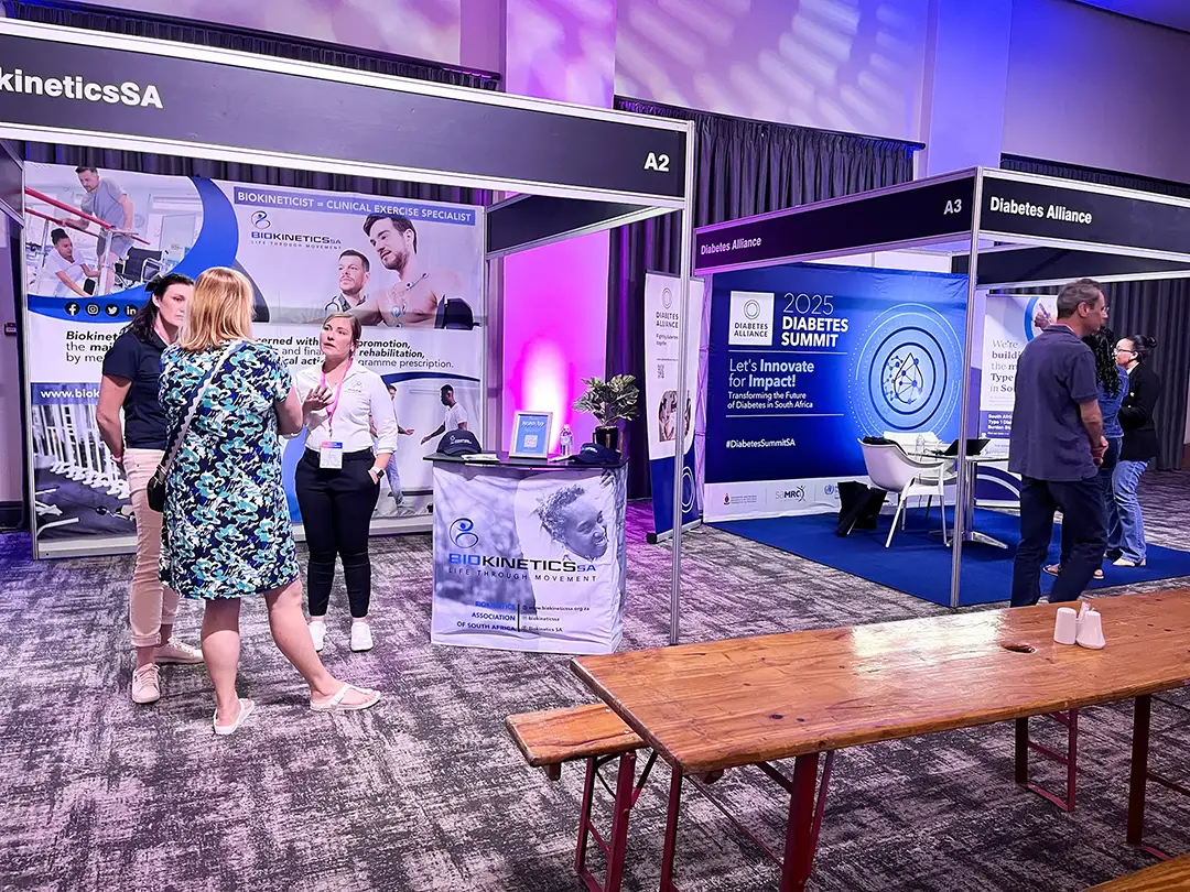 People interacting at BiokineticsSA and Diabetes Alliance booths at the 2025 Diabetes Summit.